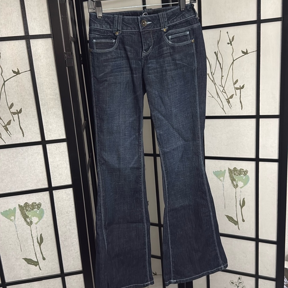 Flare Legged Jeans with white bold trim.